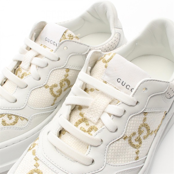 white and gold gucci shoes